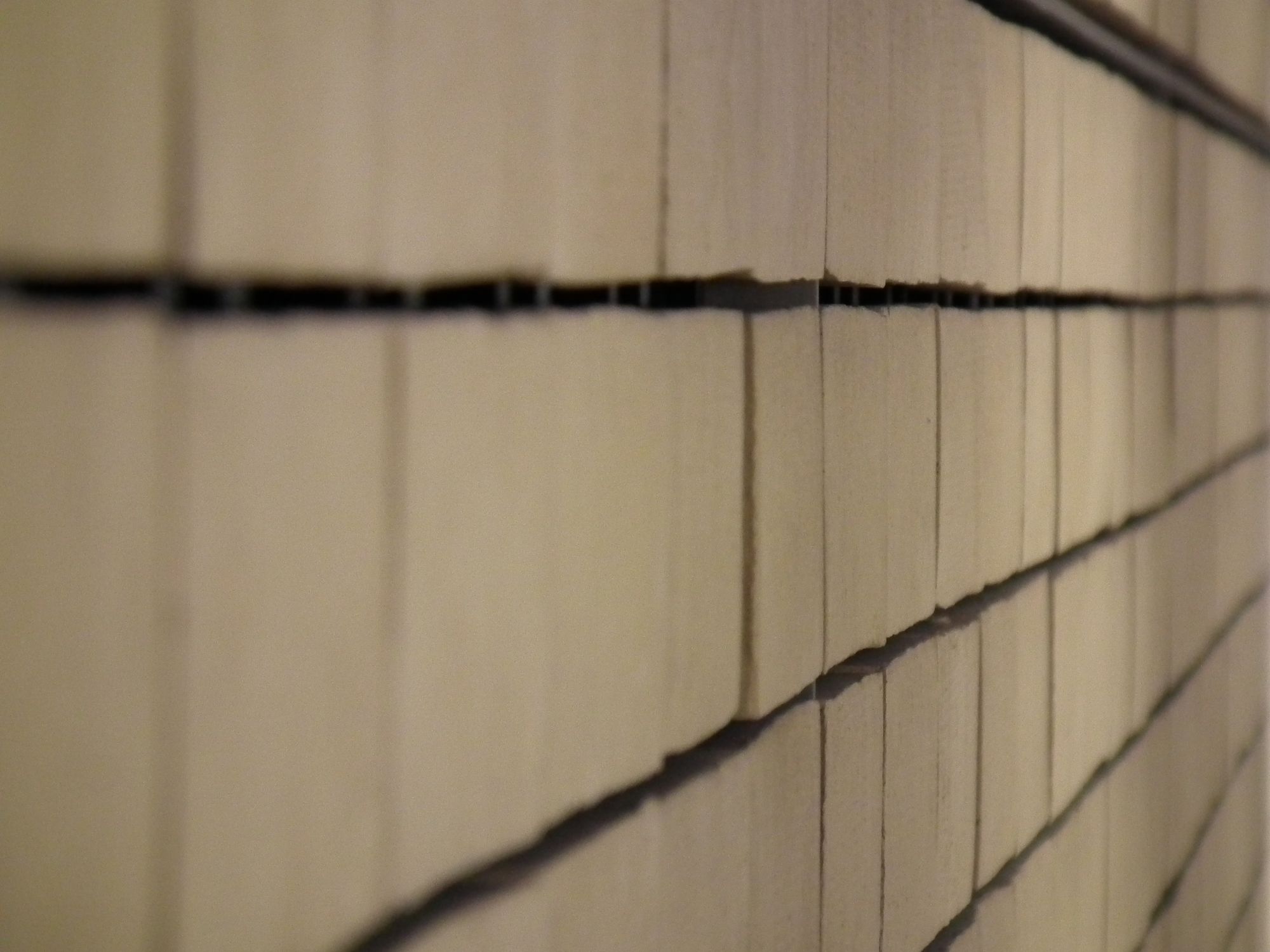 Closeup of one of the side walls, showing that the tiles are in fact bricks, with slightly irregular and rough sizes and edges.