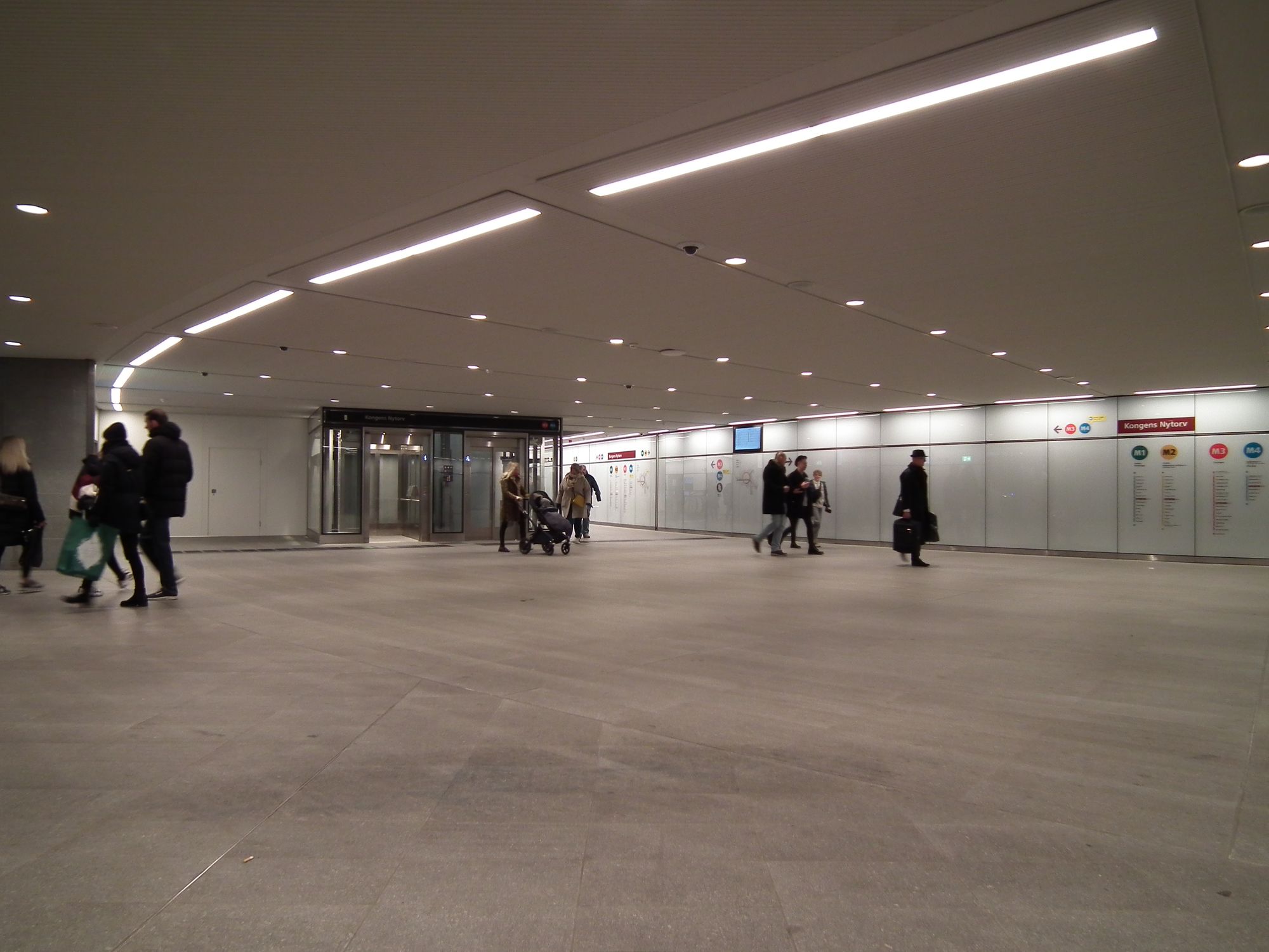 A large open underground space. Only a handful of people here right now, but this place is obviously built to handle large (for Denmark) passenger volumes.