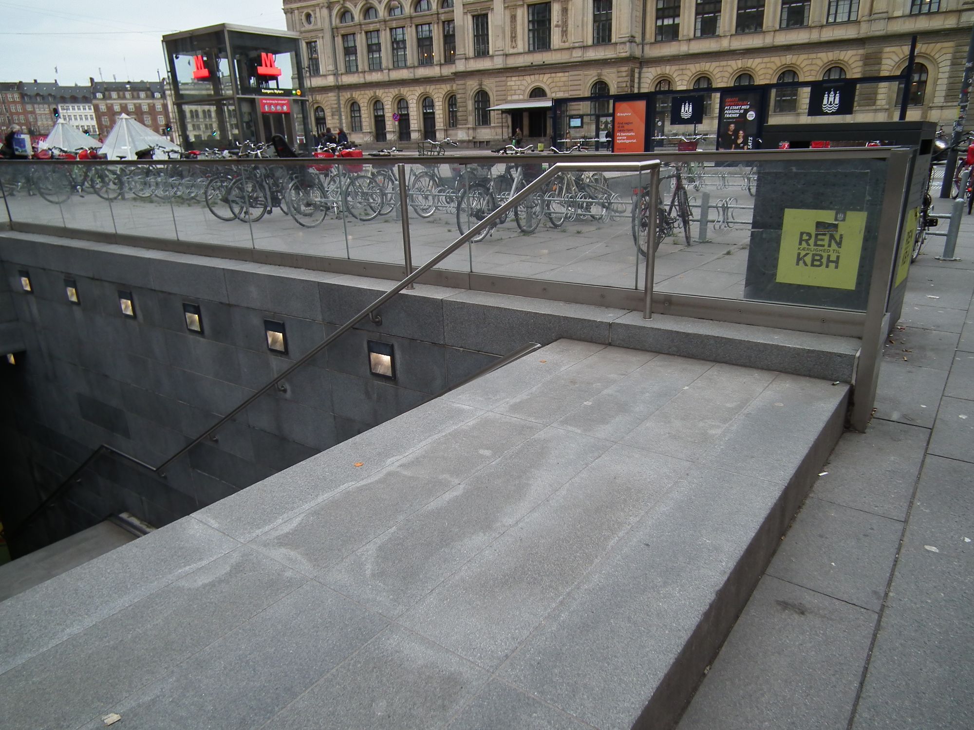 At street level, the stairs down into the back / bike entrance. There is one step *up*, before we then go down.